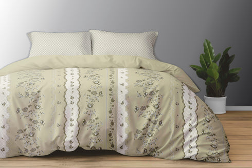A king size bed sheet set with pillow covers featuring a floral pattern, displayed on a bed with a gray wall in the background and a potted plant beside it.
